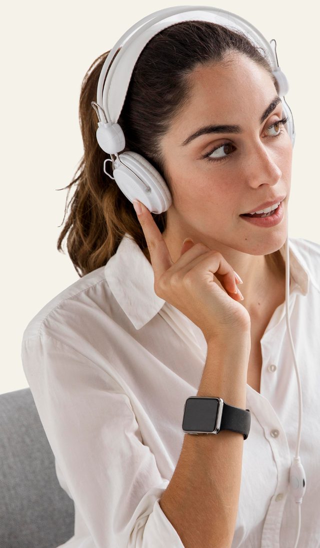 Interpreter with headphones listening attentively